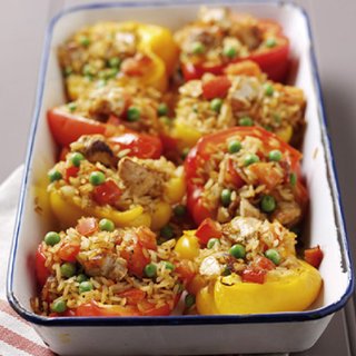 8 peppers, stuffed with vegetable and turkey mixture, in a baking tray