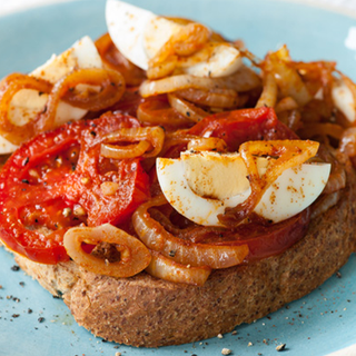 Spiced tomato and boiled egg served on toast