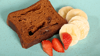 Healthier choice: a slice of malt loaf, with sliced strawberries and banana