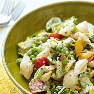 Cream cheese and green herb sauce over pasta with pepper, peas and broccoli