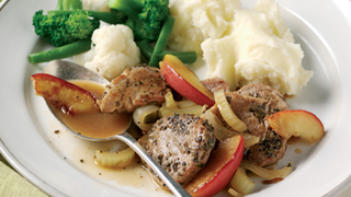 Herbed pork fillet cooked with apples and served with mashed potatoes, broccoli and cauliflower.