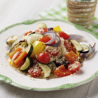 Roasted tomato, courgette, pepper and onion on a bed of cous cous