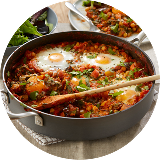 Mixed-veg rice made with tomatoes, peas, carrots and peppers.