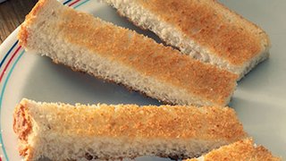 Narrow strips of toasted white bread, about 4cm wide and 10cm long