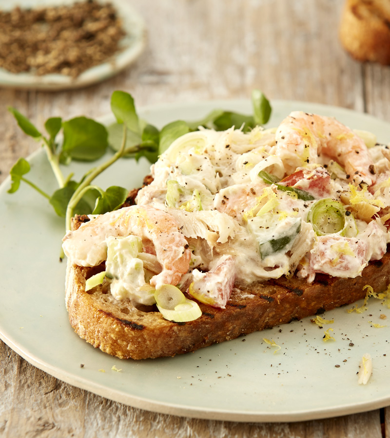 A slice of wholemeal toast topped with a prawn, mackerel, cucumber and Greek yoghurt mixture