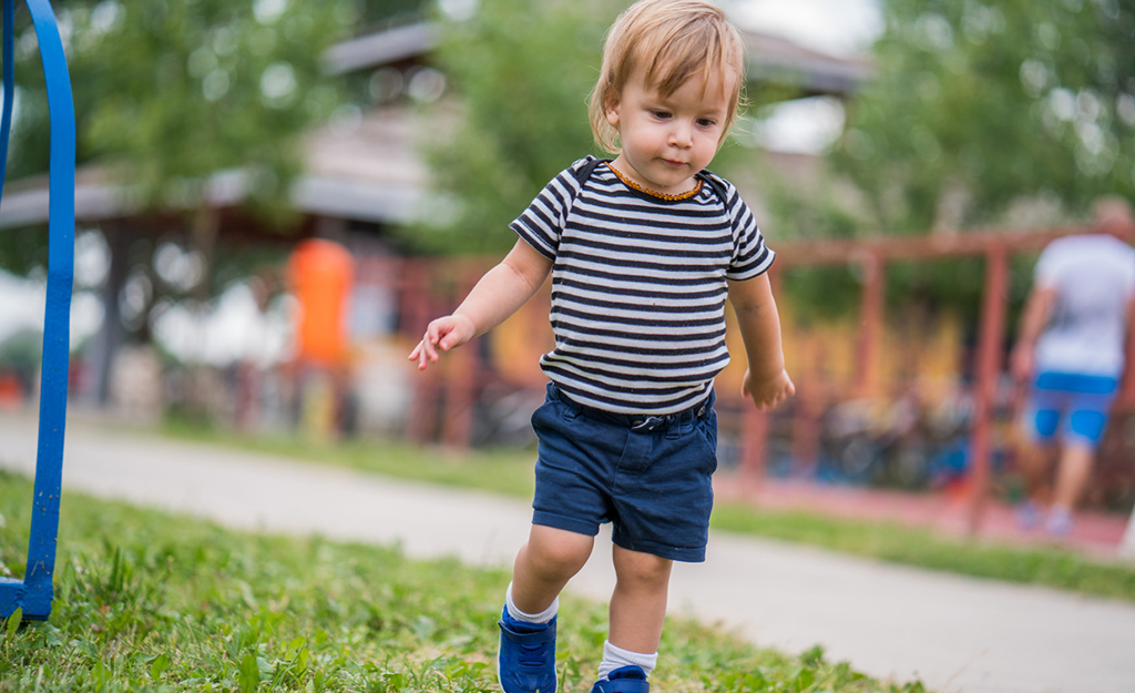toddler walking in the park